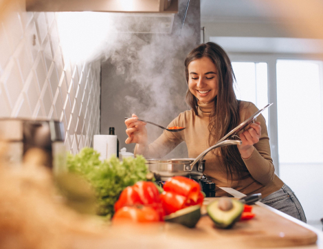 Woman cooking at kitchen